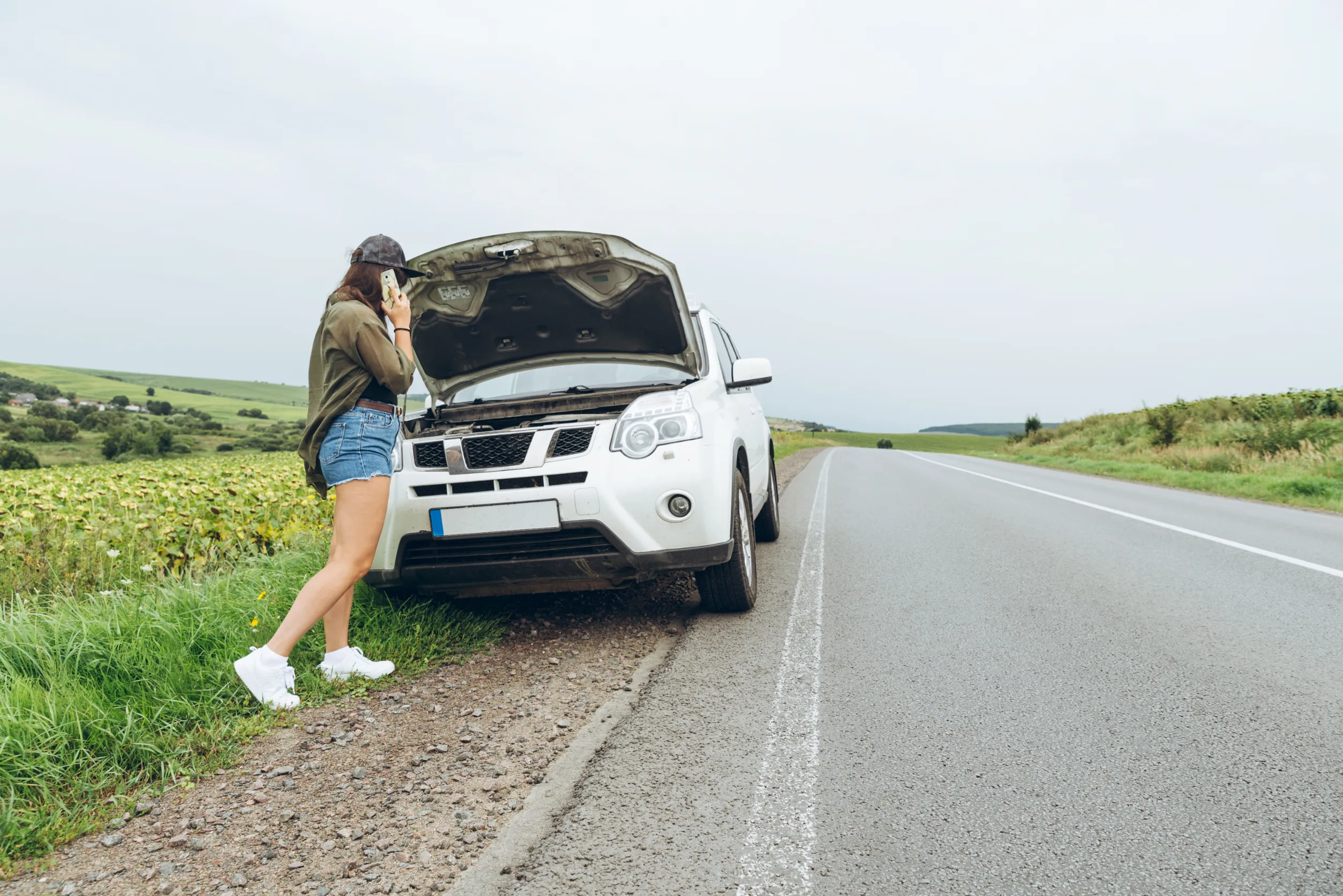 Woman calling emergency fuel recovery in Sydney after car damaged by wrong fuel, 24/7 service
