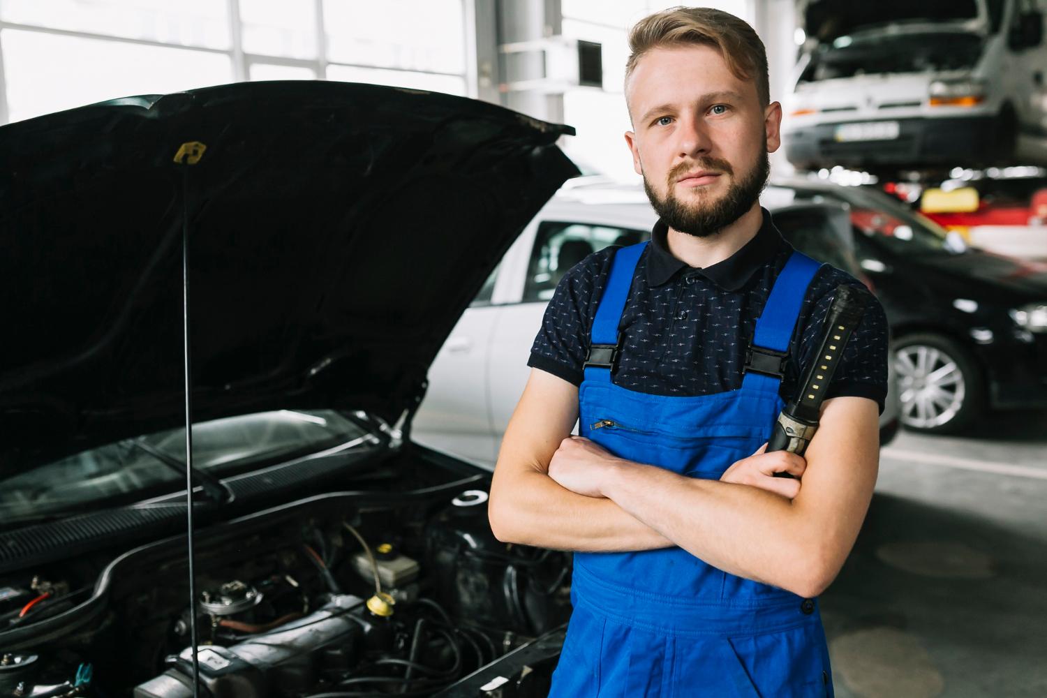 Happy mechanic after successfully fixing car affected by wrong fuel, emergency fuel recovery Sydney